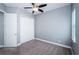 Vacant bedroom offers carpeting, ceiling fan, closet and a neutral color scheme at 8319 Swiss Chard Cir, Land O Lakes, FL 34637