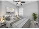 Cozy bedroom features soft, neutral tones and a decorative plant for a calming atmosphere at 8319 Swiss Chard Cir, Land O Lakes, FL 34637