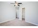 Spacious bedroom with ceiling fan and walk-in closet at 8319 Swiss Chard Cir, Land O Lakes, FL 34637