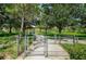 Scenic community park featuring gated entry, pathways, picnic area, and lush greenery for outdoor enjoyment at 8319 Swiss Chard Cir, Land O Lakes, FL 34637