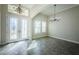 Spacious dining room with tile floors and chandelier at 8319 Swiss Chard Cir, Land O Lakes, FL 34637