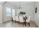 Charming dining room with a chandelier and plenty of natural light at 8319 Swiss Chard Cir, Land O Lakes, FL 34637