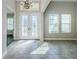 Elegant entryway with double doors and tile flooring at 8319 Swiss Chard Cir, Land O Lakes, FL 34637