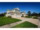Two-story house with a three-car garage and manicured lawn at 8319 Swiss Chard Cir, Land O Lakes, FL 34637