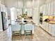 Open-concept kitchen with a large island, stainless steel appliances, and granite counters at 8319 Swiss Chard Cir, Land O Lakes, FL 34637