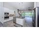 Modern kitchen with granite counters and stainless steel appliances at 8319 Swiss Chard Cir, Land O Lakes, FL 34637