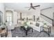 Bright living room features a neutral palette, modern decor, and an open layout with ample natural light at 8319 Swiss Chard Cir, Land O Lakes, FL 34637