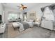 Spacious main bedroom with sitting area and stylish decor at 8319 Swiss Chard Cir, Land O Lakes, FL 34637