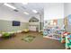 room with tables, chairs, and toys at 8319 Swiss Chard Cir, Land O Lakes, FL 34637