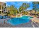 Inviting community pool with surrounding lounge chairs at 8605 Mallard Reserve Dr # 101, Tampa, FL 33614