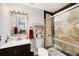 Clean bathroom with a large shower and updated vanity at 9481 Highland Oak Dr # 703, Tampa, FL 33647