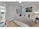 King-size bed in bright bedroom with adjacent bathroom at 1074 Signet Dr, Apollo Beach, FL 33572