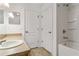 Bathroom featuring a vanity with a white sink and a shower-tub combination with white tiles at 10817 Great Carlisle Ct, Riverview, FL 33578