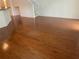 Spacious living room featuring hardwood floors and staircase at 10817 Great Carlisle Ct, Riverview, FL 33578