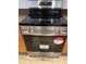 Modern stainless steel Frigidaire stove with sleek black cooktop at 10817 Great Carlisle Ct, Riverview, FL 33578
