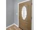 Close-up of an entry door with a stylish oval glass design at 10824 79Th E St, Parrish, FL 34219