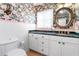 Charming bathroom with marble countertop and floral wallpaper at 1131 Snell Isle Ne Blvd, St Petersburg, FL 33704
