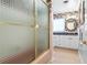 Bathroom with pink tile and floral wallpaper at 1131 Snell Isle Ne Blvd, St Petersburg, FL 33704