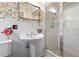 Charming bathroom with pedestal sink and shower at 1131 Snell Isle Ne Blvd, St Petersburg, FL 33704