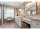 Elegant bathroom with double vanity and marble countertops at 1131 Snell Isle Ne Blvd, St Petersburg, FL 33704