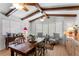 Cozy dining room with exposed beam ceiling, natural light, and charming decor at 1131 Snell Isle Ne Blvd, St Petersburg, FL 33704