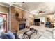 Spacious living room features a brick fireplace and hardwood floors at 1131 Snell Isle Ne Blvd, St Petersburg, FL 33704