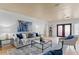 Bright living room with a comfortable sofa, stylish decor, and a glass coffee table on a patterned rug at 1131 Snell Isle Ne Blvd, St Petersburg, FL 33704
