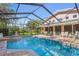 Large, screened pool and spa with patio furniture at 1131 Snell Isle Ne Blvd, St Petersburg, FL 33704