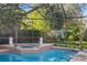 Relaxing pool and spa with a screened enclosure at 1131 Snell Isle Ne Blvd, St Petersburg, FL 33704