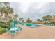 Enjoy the turquoise pool with surrounding patio furniture at 1230 Gulf Blvd # 1604, Clearwater, FL 33767