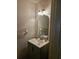 Small bathroom with vanity, sink, and arched mirror at 1252 Costa Mesa Dr, Wesley Chapel, FL 33543