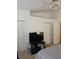 Bedroom with double closets and large TV at 1252 Costa Mesa Dr, Wesley Chapel, FL 33543