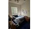 Small bedroom with double bed, nightstand, and window at 1252 Costa Mesa Dr, Wesley Chapel, FL 33543