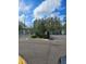 Gated community entrance with landscaping at 1252 Costa Mesa Dr, Wesley Chapel, FL 33543