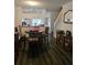 Dining room with wooden table, chairs, and kitchen view at 1252 Costa Mesa Dr, Wesley Chapel, FL 33543