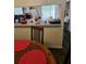 Dining room with wooden table and view into kitchen at 1252 Costa Mesa Dr, Wesley Chapel, FL 33543