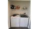 Closet with washer and dryer, shelving for storage at 1252 Costa Mesa Dr, Wesley Chapel, FL 33543