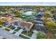 Aerial view of a residential neighborhood with houses and a pond at 12612 Midpointe Dr, Riverview, FL 33579