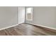 Well-lit bedroom with wood-look floors and closet at 12612 Midpointe Dr, Riverview, FL 33579