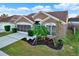 Charming house with landscaped yard and driveway at 12612 Midpointe Dr, Riverview, FL 33579