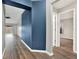 Bright hallway with new flooring, leading to other rooms at 12612 Midpointe Dr, Riverview, FL 33579
