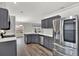 Modern kitchen with stainless steel appliances and ample counter space at 12612 Midpointe Dr, Riverview, FL 33579