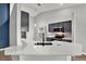 Modern kitchen with white quartz countertops and dark cabinets at 12612 Midpointe Dr, Riverview, FL 33579