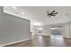 Spacious living room featuring wood-look floors and access to backyard at 12612 Midpointe Dr, Riverview, FL 33579