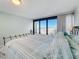 Spacious bedroom with ocean views and large windows at 1390 Gulf Blvd # 302, Clearwater Beach, FL 33767