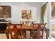 Elegant dining room with a charming wooden table and chairs at 15433 Stone House Dr, Brooksville, FL 34604