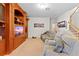 Relaxing home theater room featuring comfortable seating and built-in shelving at 15433 Stone House Dr, Brooksville, FL 34604