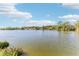 Peaceful lake view with homes and lush landscape at 15624 Morning Dr, Lutz, FL 33559