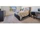 Bedroom with a bed, dresser, and workspace at 16838 Delia St, Wimauma, FL 33598