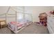 bedroom with a unique bed frame and playful decor at 16838 Delia St, Wimauma, FL 33598